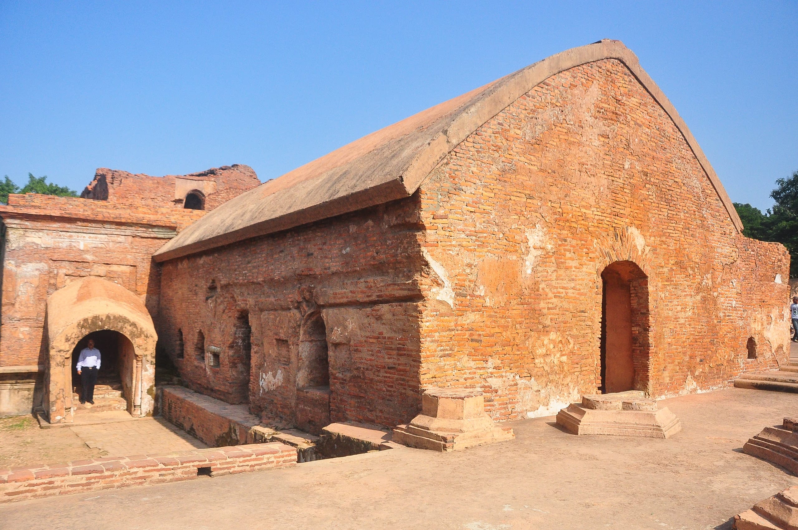 Barrel-vaulted brick hall of the Talatal Ghar palace-fort under a clear sky